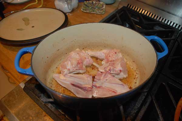 Chicken parts browning in the dutch oven